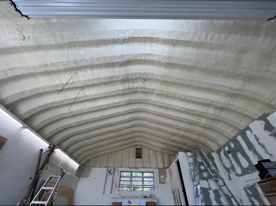 Spray polyurethane foam applied to the underside of a metal roof deck in Porter